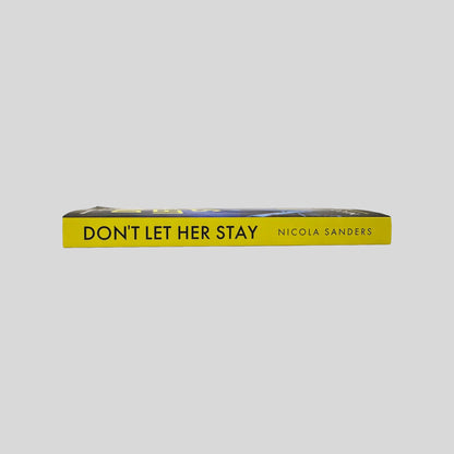 Close-up spine view of Don't Let Her Stay by Nicola Sanders centered on a neutral light gray background. Spine shows no creasing. Pages lay flat.