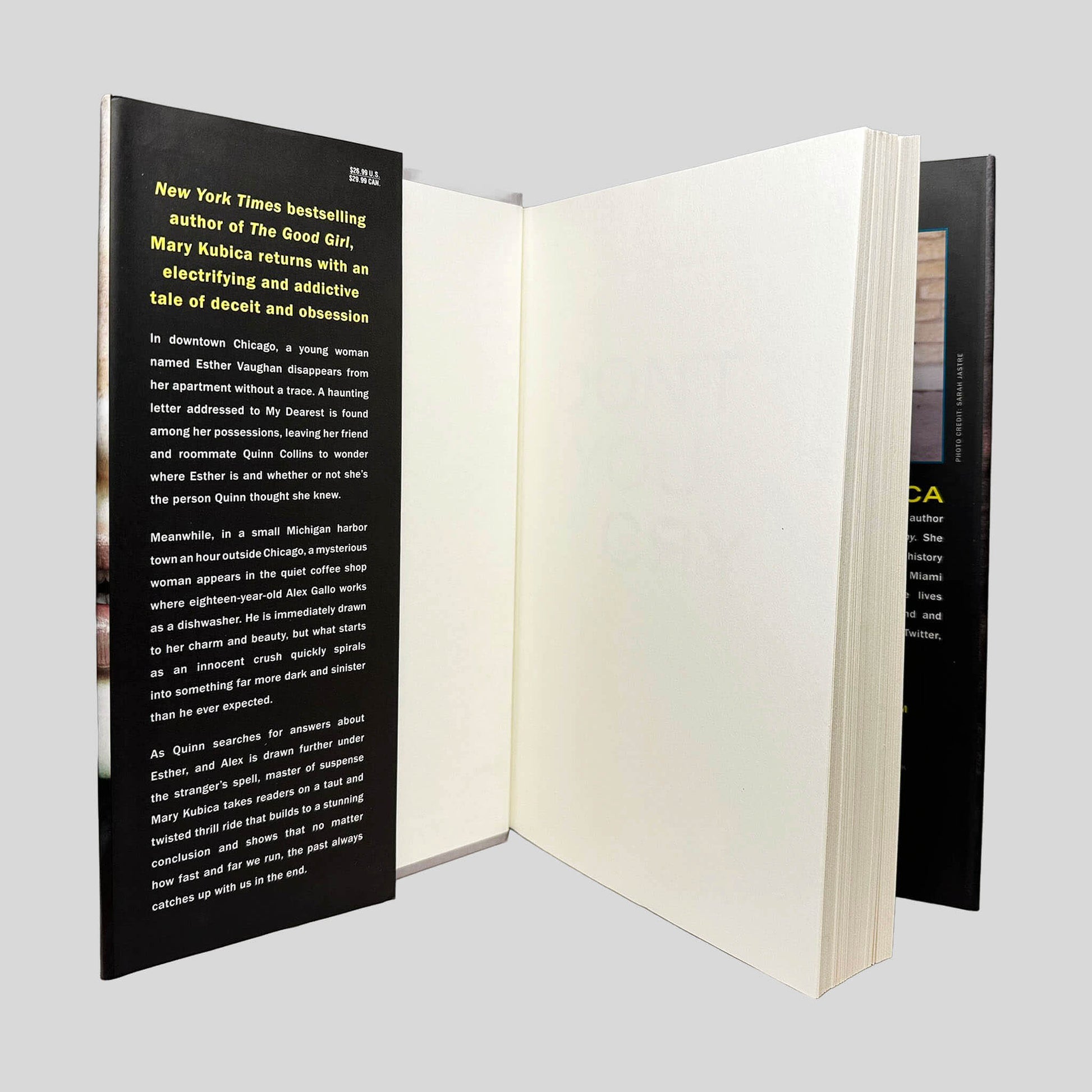 Inside front cover view of Don't You Cry by Mary Kubica centered on a neutral light gray background. Dust jacket present and is pristine. Pages are tight and crisp.
