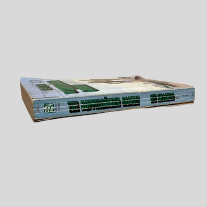 Close-up spine view of Doppelganger Gambit by Lee Killough centered on a neutral light gray background. Spine shows creasing and chipping at the top and bottom of the spine. Pages lay flat.