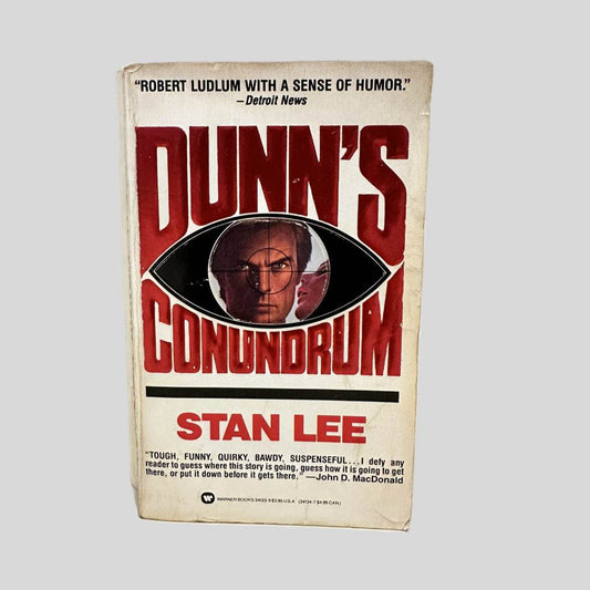 Front cover view of Dunn's Conundrum by Stan Lee centered on a neutral light gray background. Chipping and creasing is present. Foxing to the edges.