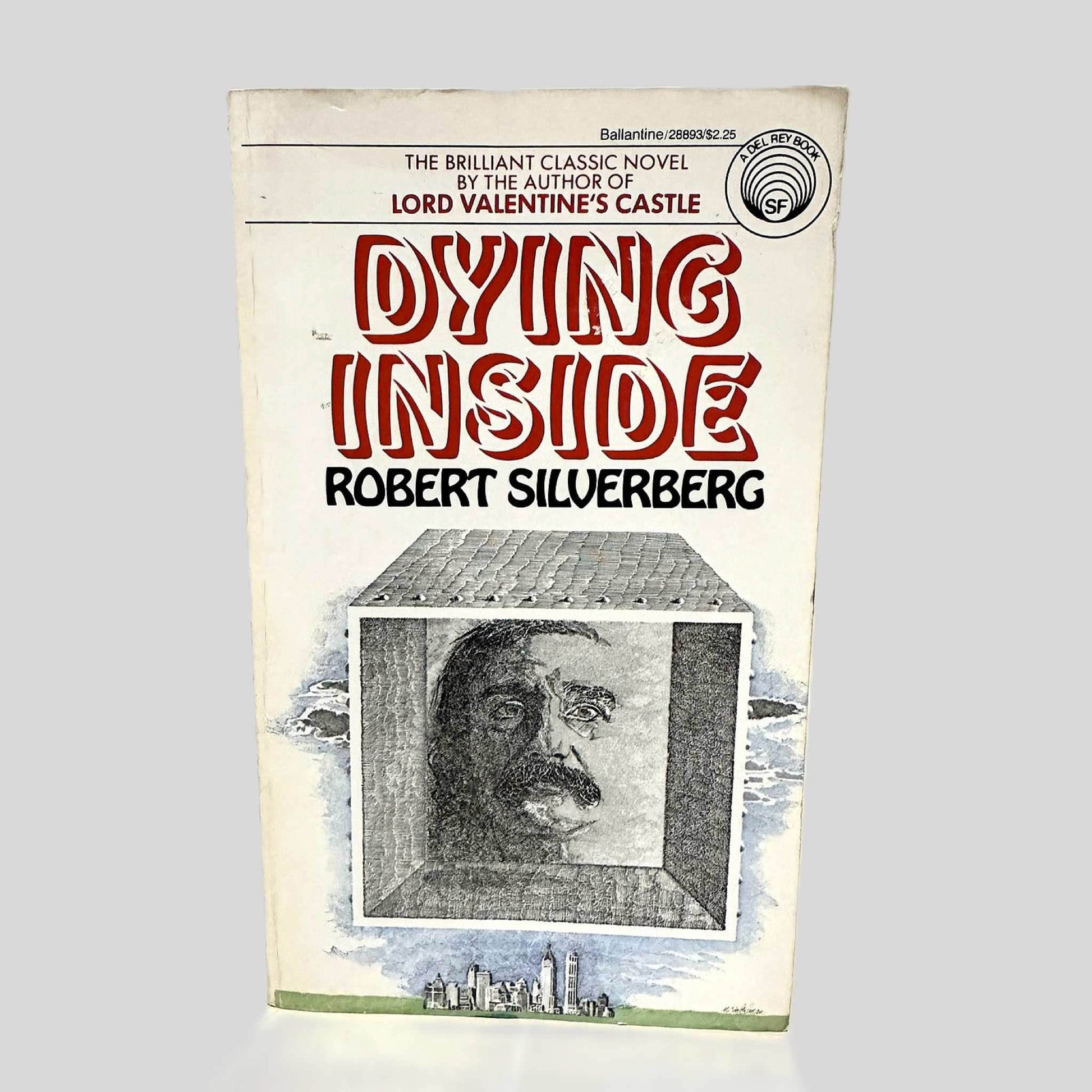 Front cover view of Dying Inside by Robert Silverberg centered on a neutral light gray background. Normal chipping present around the edges from age.