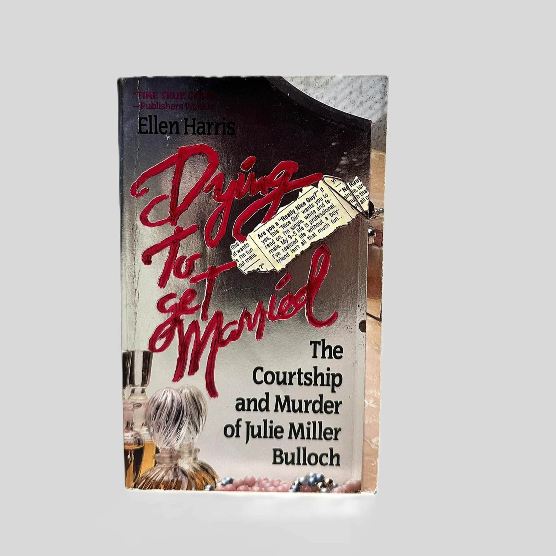 Front cover view of Dying to Get Married by Ellen Harris centered on a neutral light gray background. Creasing is present near the spine.