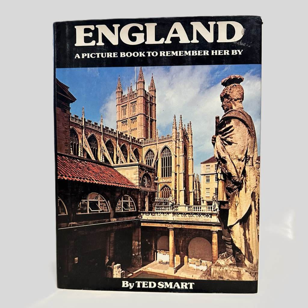 Front cover view of England a Picture Book to Remember Her By by Ted Smart centered on a neutral light gray background. Dust jacket is present. Chipping to the top right corner.