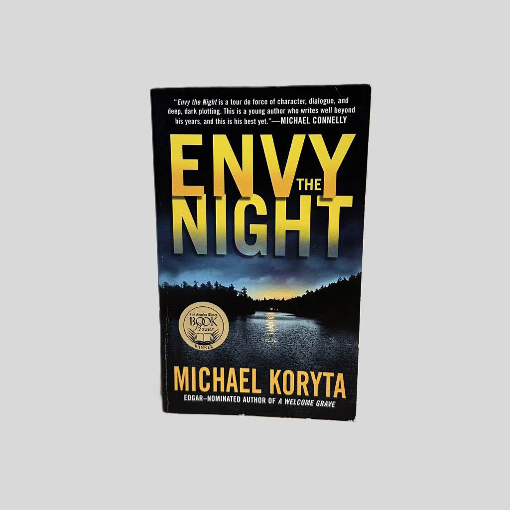 Front cover view of Envy the Night by Michael Koryta centered on a neutral light gray background. 
