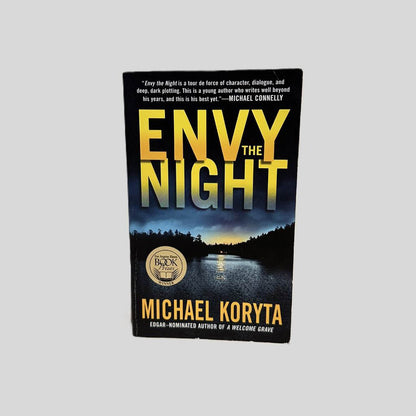 Front cover view of Envy the Night by Michael Koryta centered on a neutral light gray background. 