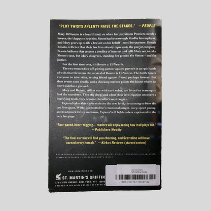 Back cover view of Exposed by Lisa Scottoline centered on a neutral light gray background. Minor chipping along the bottom edge of the back cover.