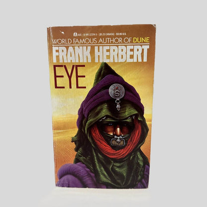 Front cover view of Eye by Frank Herbert centered on a neutral light gray background. Creasing near the spine edge and the top right corner. Cover art is vibrant.