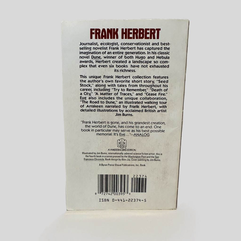 Back cover view of Eye by Frank Herbert centered on a neutral light gray background. Minor chipping along the bottom edge.