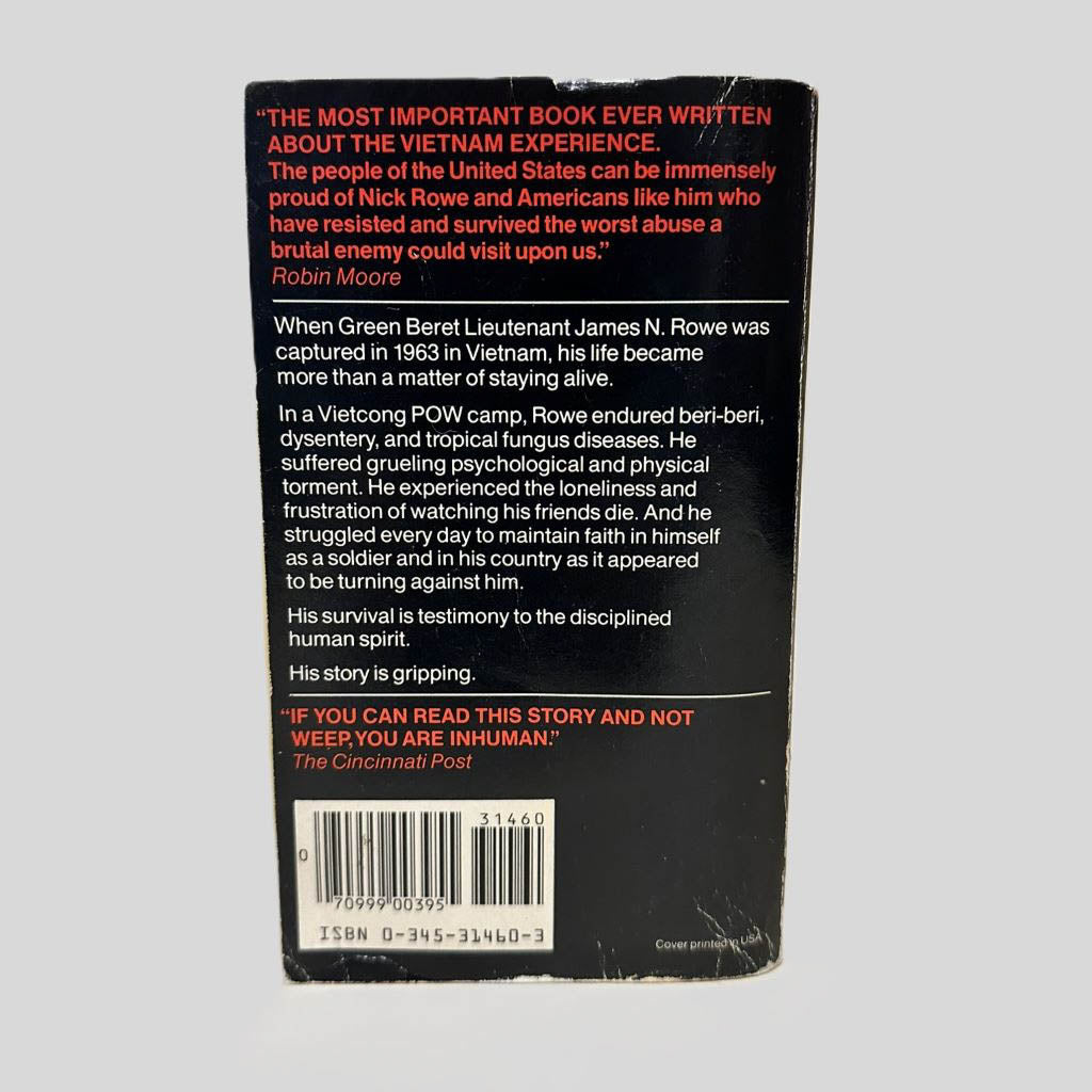 Back cover view of Five Years to Freedom: The True Story of a Vietnam POW by James N. Rowe centered on a neutral light gray background. Chipping and creasing are present.
