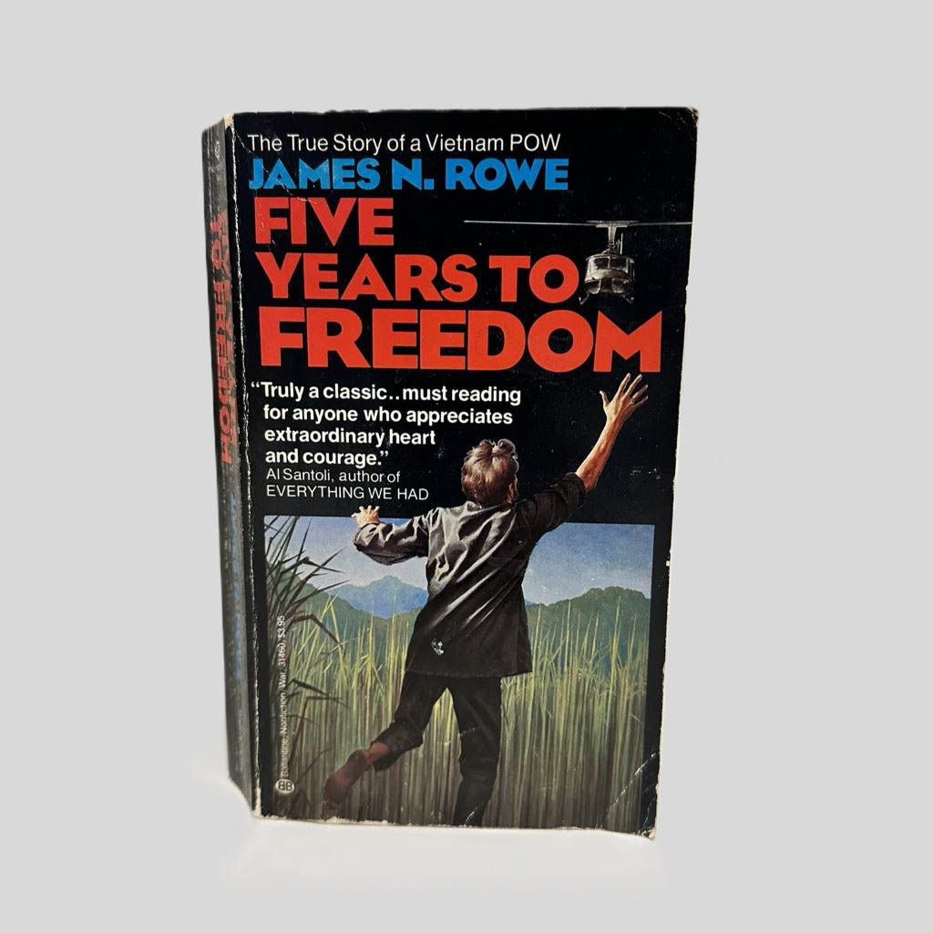 Front cover view of Five Years to Freedom: The True Story of a Vietnam POW by James N. Rowe centered on a neutral light gray background. Chipping in the top left corner. Creasing on bottom right cover.