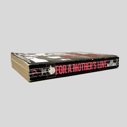Close-up spine view of For a Mother's Love by Lee Butcher centered on a neutral light gray background. Spine shows creasing and rubbing.