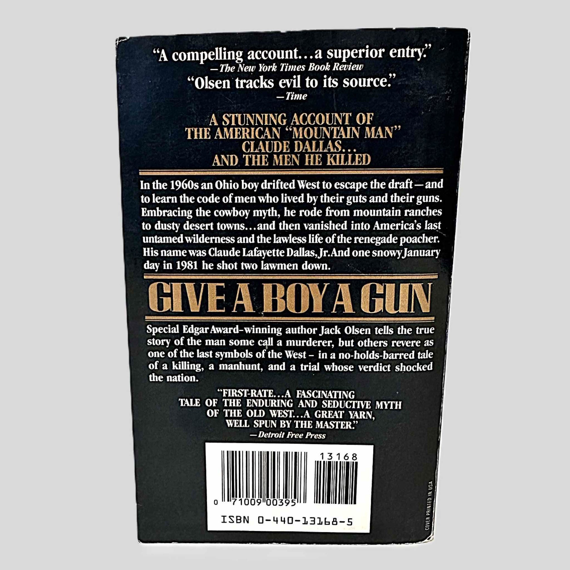 Back cover view of Give A Boy A Gun by Jack Olsen centered on a neutral light gray background. 