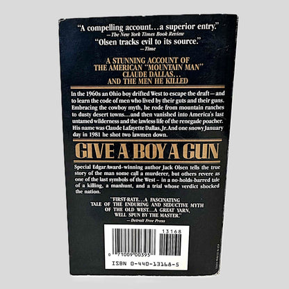 Back cover view of Give A Boy A Gun by Jack Olsen centered on a neutral light gray background. 