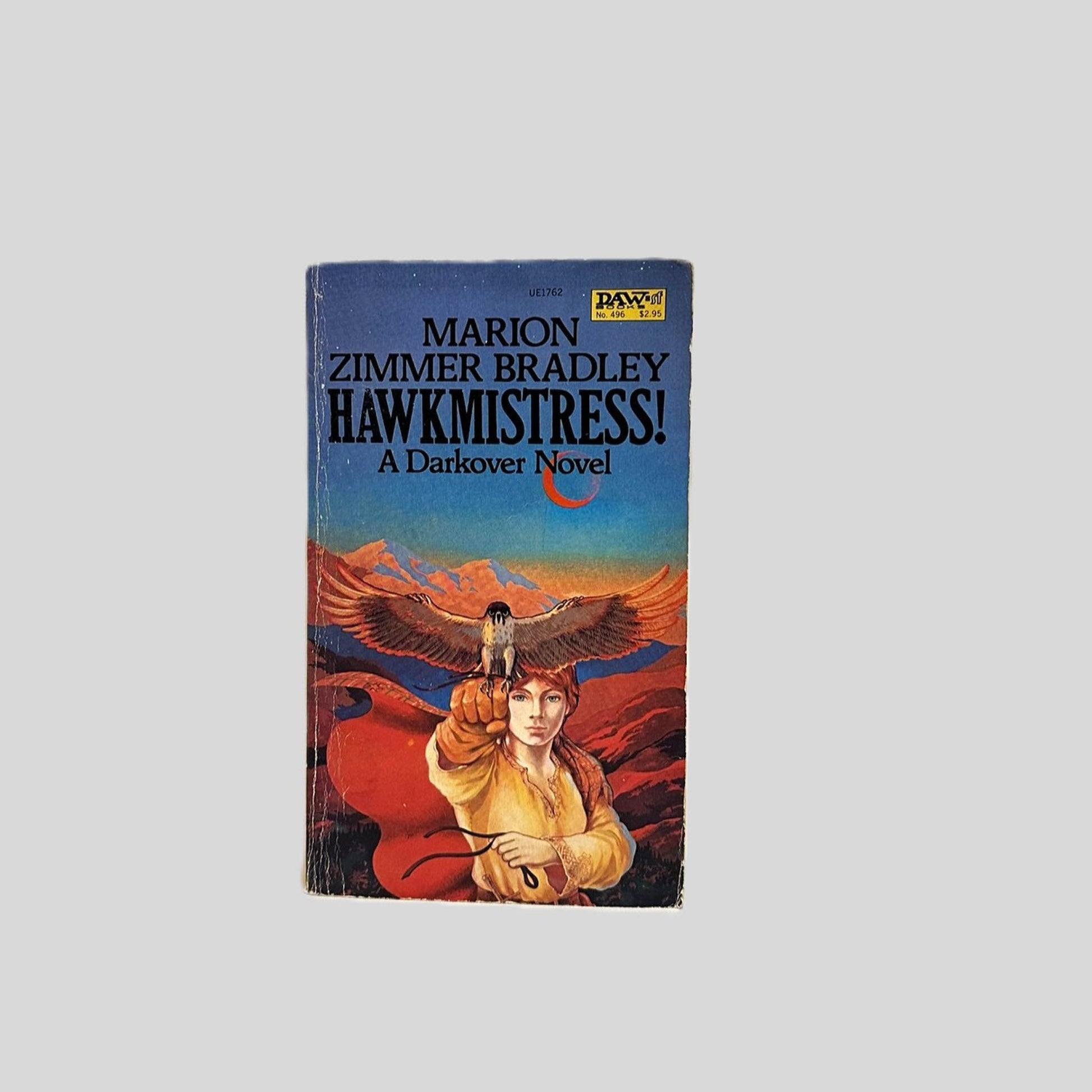 Front cover view of Hawkmistress! by Marion Zimmer Bradley centered on a neutral light gray background. Normal chipping around the edges. Creasing near the spine.
