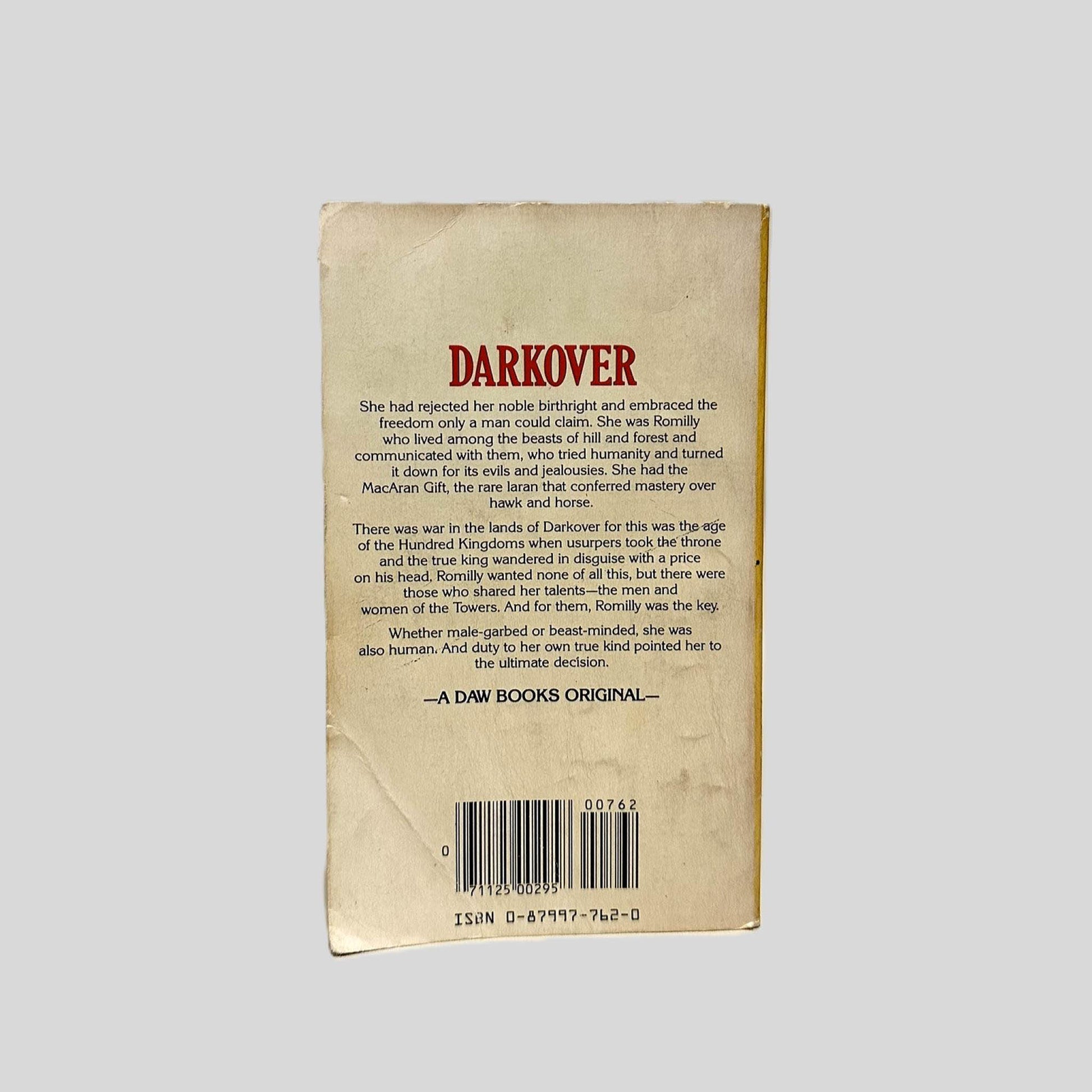 Back cover view of Hawkmistress! by Marion Zimmer Bradley centered on a neutral light gray background. Chipping present around the edges. Creasing at the corners.