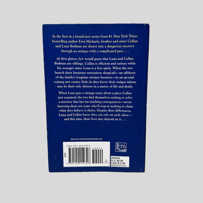Back cover view of Hidden by Fern Michaels centered on a neutral light gray background. 