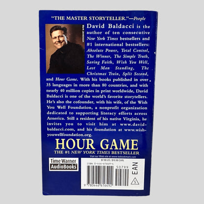 Back cover view of Hour Game by David Baldacci centered on a neutral light gray background. 
