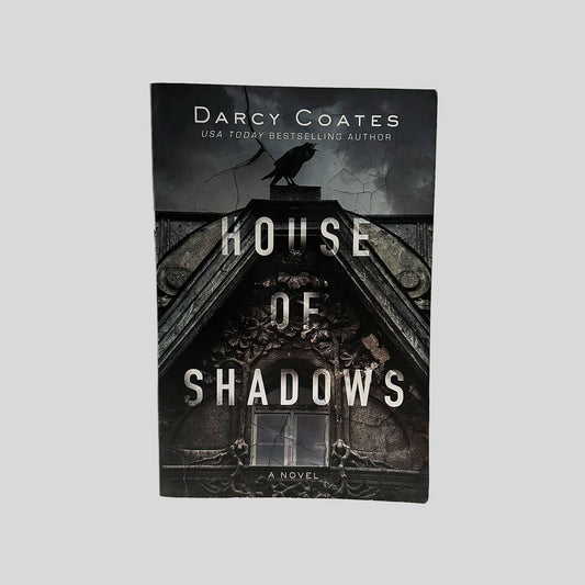 Front cover view of House of Shadows by Darcy Coates centered on a neutral light gray background. 