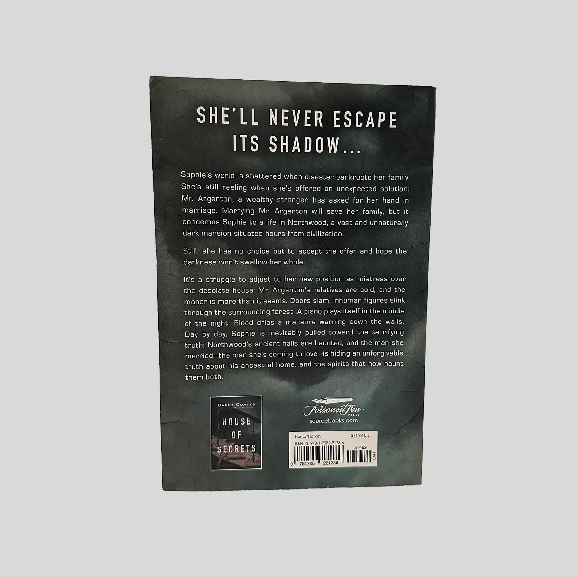 Back cover view of House of Shadows by Darcy Coates centered on a neutral light gray background. 