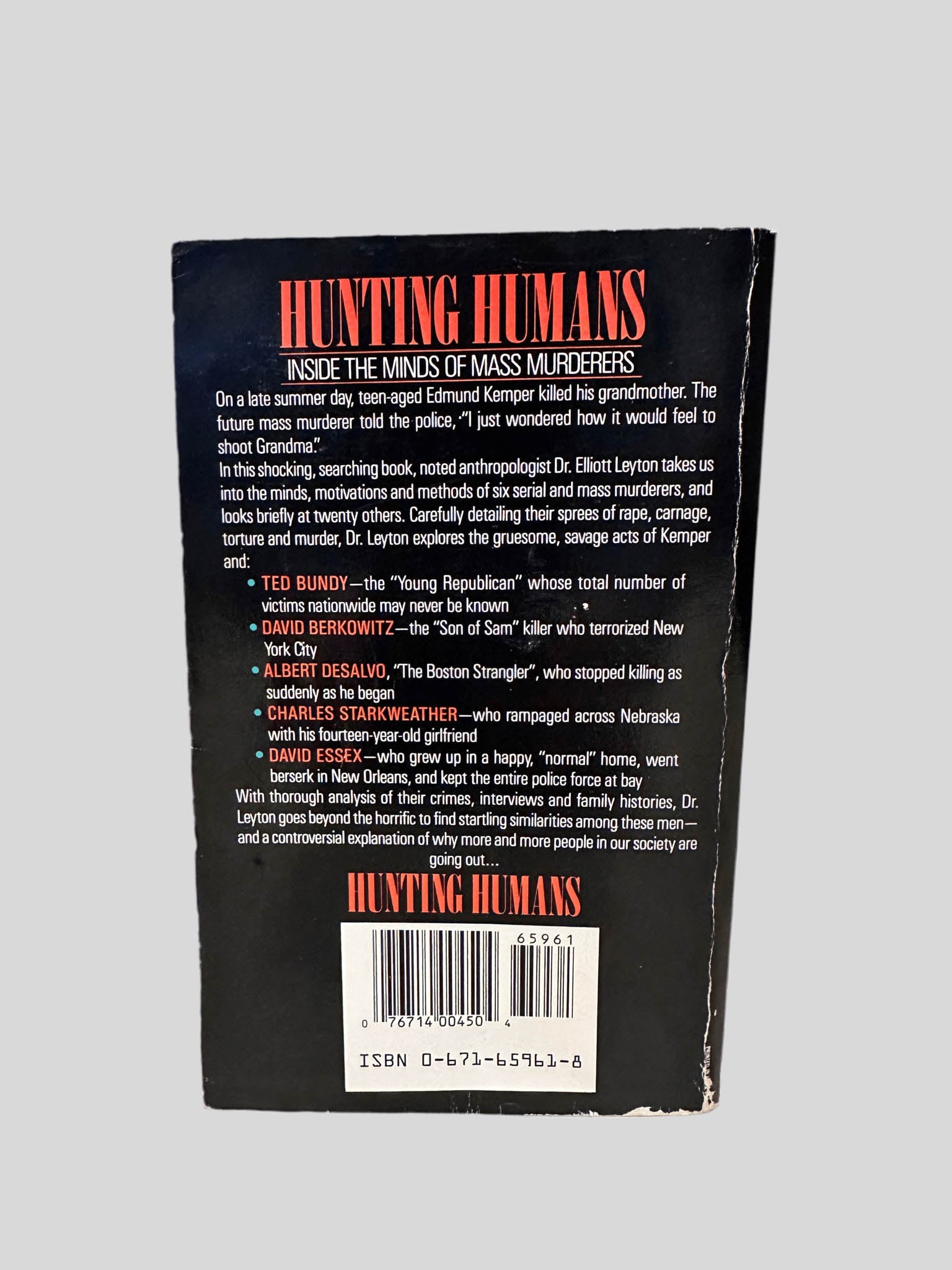 Back cover view of Hunting Humans by Elliott Leyton centered on a neutral light gray background. 