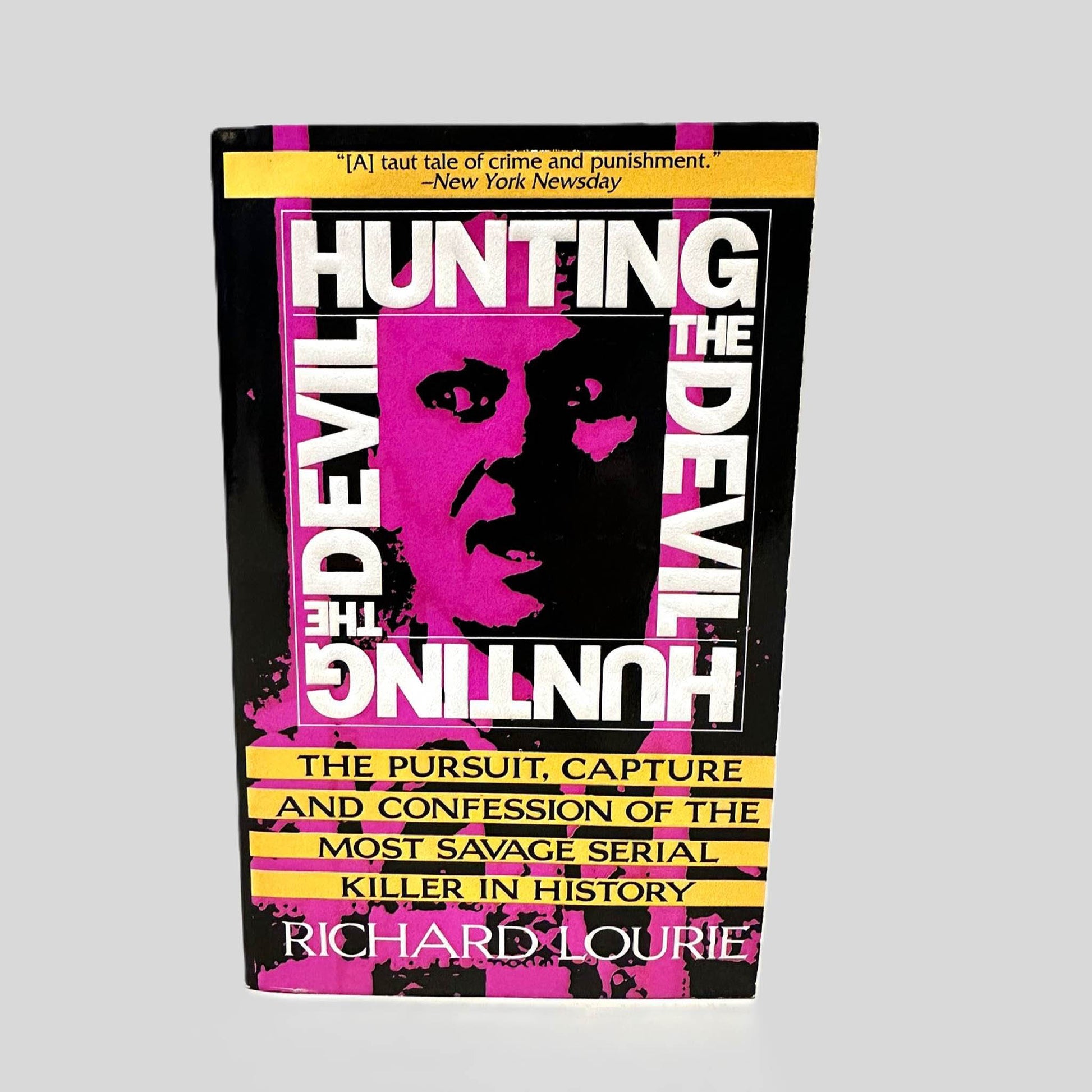 Front cover view of Hunting the Devil by Richard Lourie centered on a neutral light gray background. 