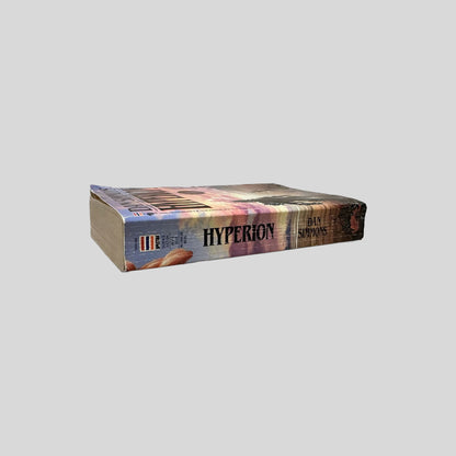 Close-up spine view of Hyperion by Dan Simmons centered on a neutral light gray background. 