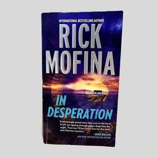 Front cover view of In Desperation by Rick Mofina centered on a neutral light gray background. 
