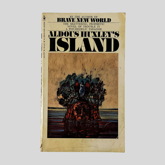 The front cover of the 1971 Bantam edition of "Island" by Aldous Huxley, featuring a surreal illustration of a human head merged with a tree-like structure against a sea and sky backdrop.