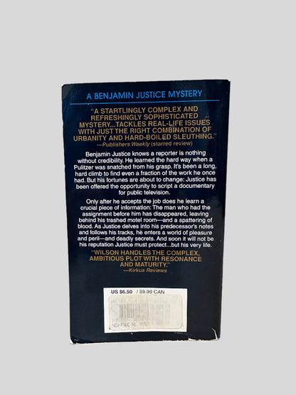 Back cover view of Justice at Risk by John Morgan Wilson centered on a neutral light gray background. 