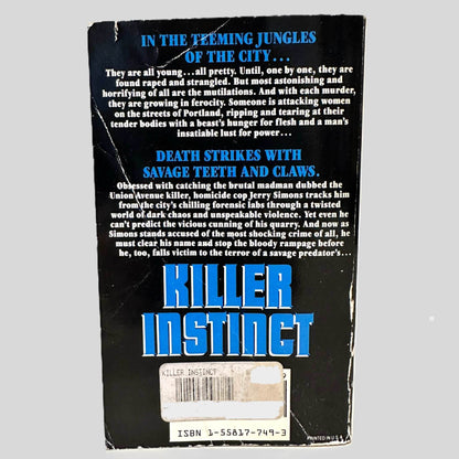 Back cover view of Killer Instinct by Larry C Pike centered on a neutral light gray background. Creasing and chipping are present.