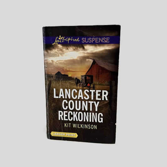 Front cover view of Lancaster County Reckoning by Kit Wilkinson centered on a neutral light gray background. Large print copy. Creasing visible near the spine edge.