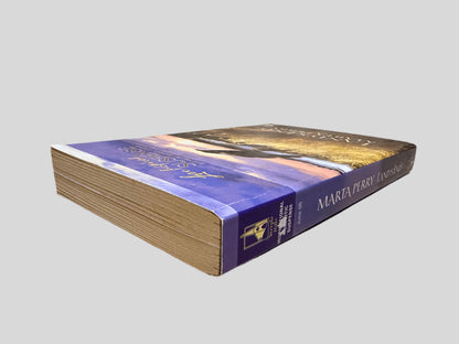 Close-up spine view of Land's End by Marta Perry centered on a neutral light gray background. Spine shows minimal creasing. Pages lay flat.