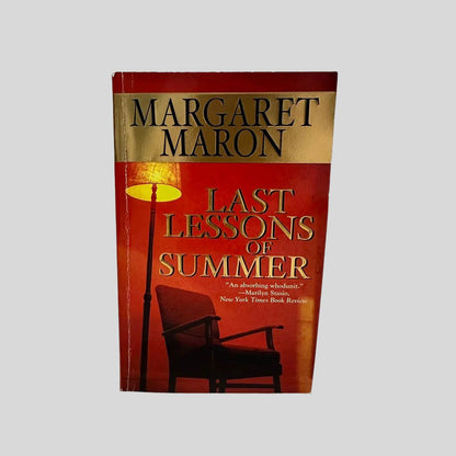 Front cover view of Last Lessons of Summer by Margaret Maron centered on a neutral light gray background. Creasing is present along the spine edge.