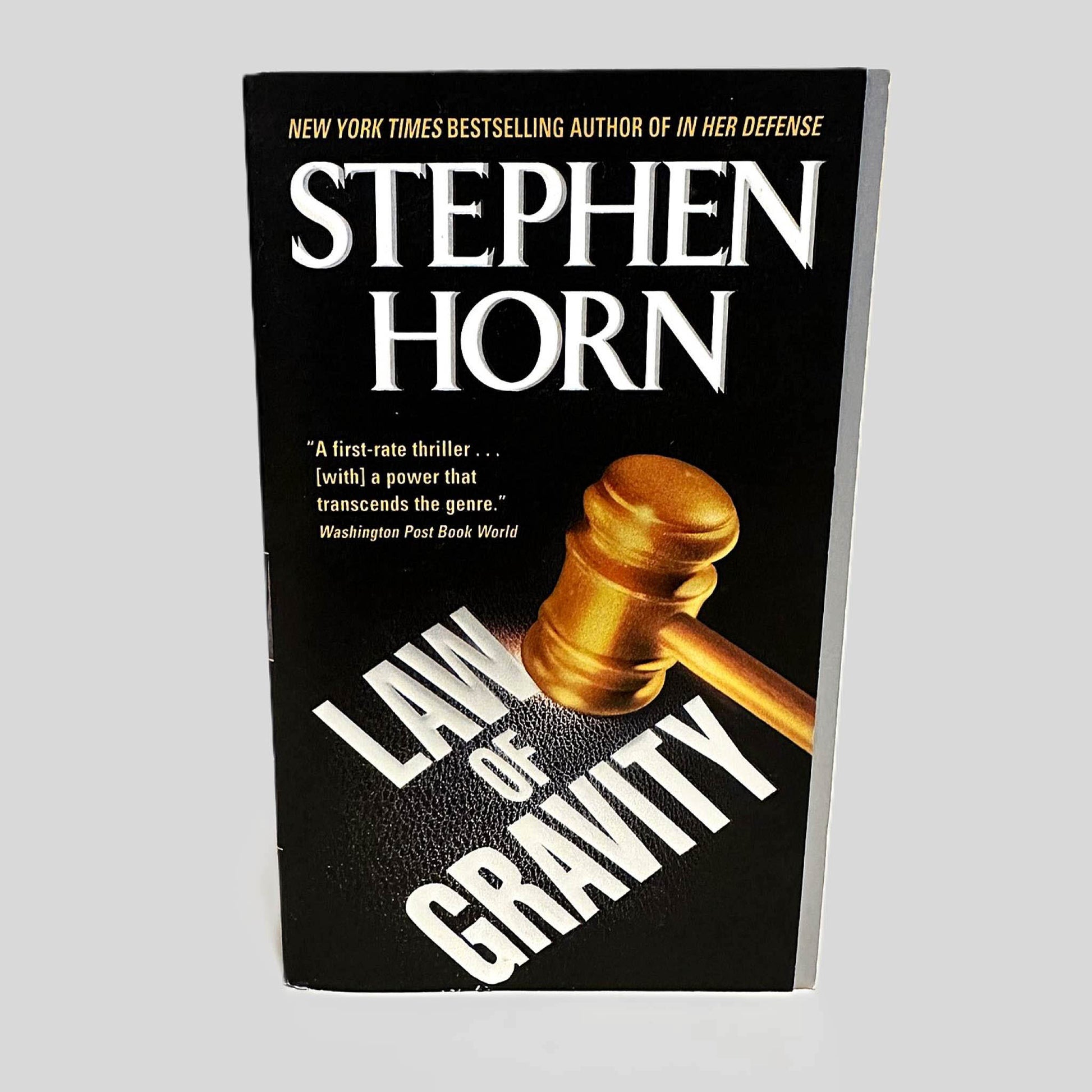 Front cover view of Law of Gravity by Stephen Horn centered on a neutral light gray background. Cover shows no signs of damage.