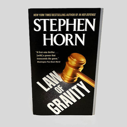 Front cover view of Law of Gravity by Stephen Horn centered on a neutral light gray background. Cover shows no signs of damage.