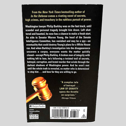 Back cover view of Law of Gravity by Stephen Horn centered on a neutral light gray background. Cover shows no signs of damage.