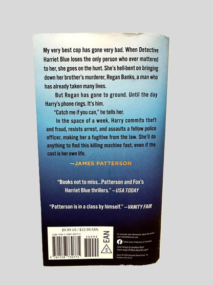 Back cover view of Liar Liar by James Patterson & Candice Fox centered on a neutral light gray background. Chipping present along the top edge of the back cover.