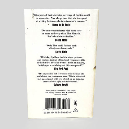 Back cover view of Live at 10:00, Dead at 10:15 by Elsa Klensch centered on a neutral light gray background. 