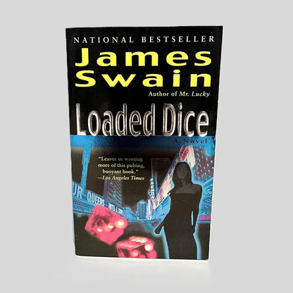Front cover view of Loaded Dice by James Swain centered on a neutral light gray background. 