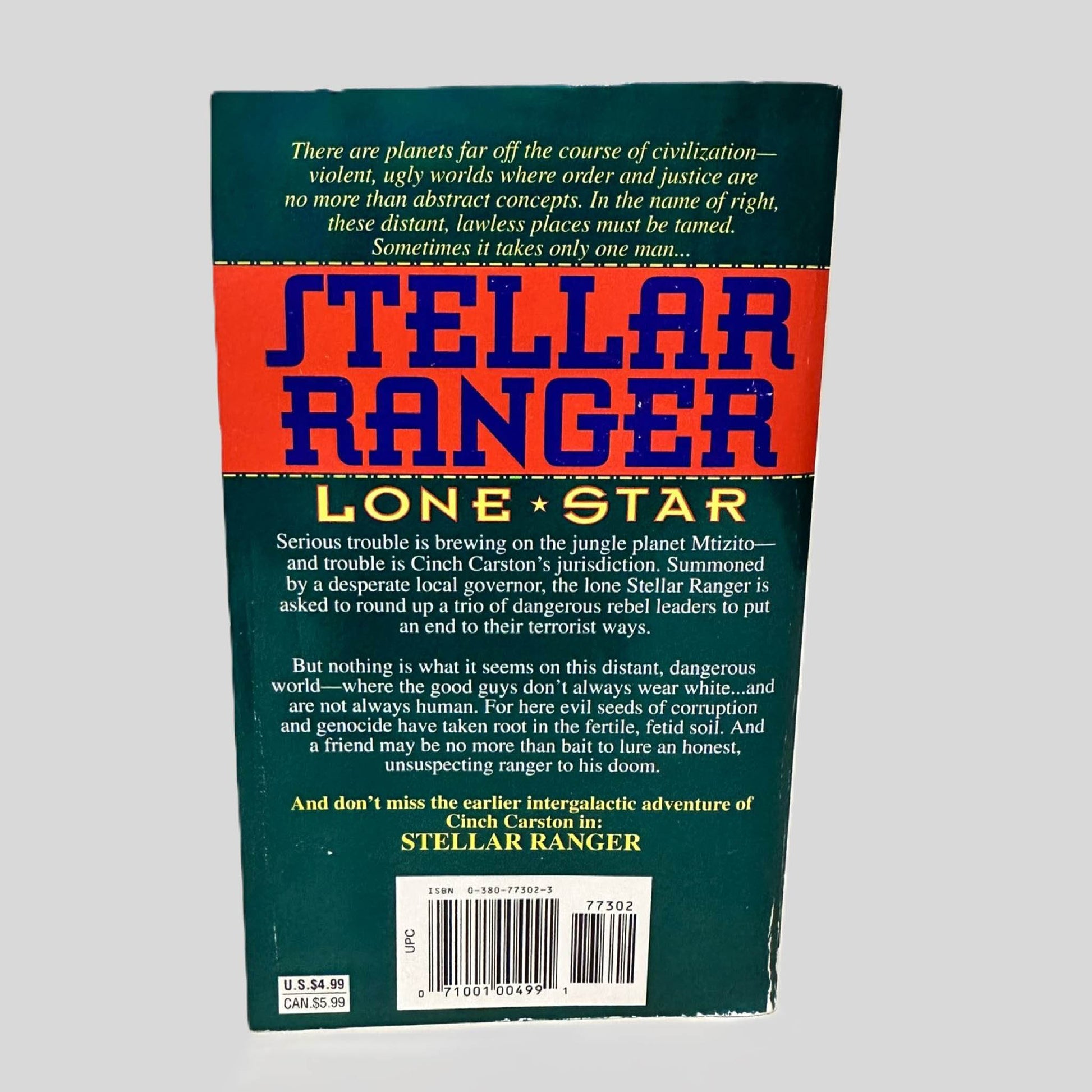 Back cover view of Lone Star by Steve Perry centered on a neutral light gray background. Some chipping on the spine corner on the lower left.