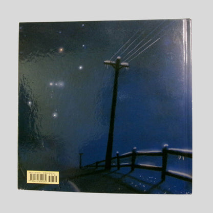 Back cover view of Long Night Moon by Cynthia Rylant centered on a neutral light gray background. 