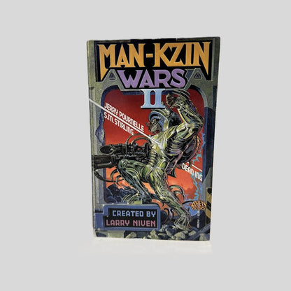 Front cover view of Man-Kzin Wars II by Larry Niven centered on a neutral light gray background. Minor creasing near the spine edge.