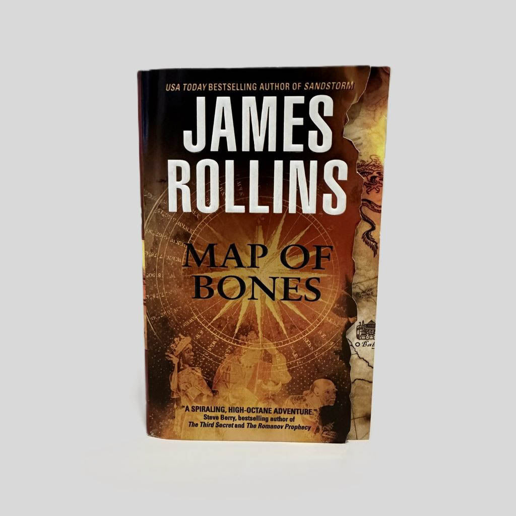 Front cover view of Map of Bones by James Rollins centered on a neutral light gray background. Front cover is in pristine condition.