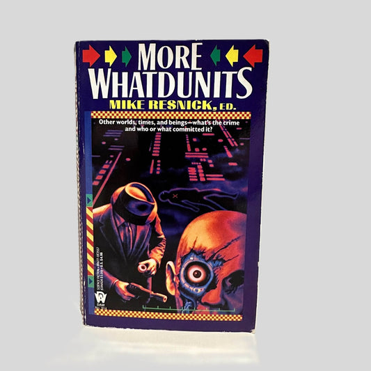 Front cover view of More Whatdunits by Mike Resnick, ED. centered on a neutral light gray background. Minor chipping to the lower edge and corner of the front cover.