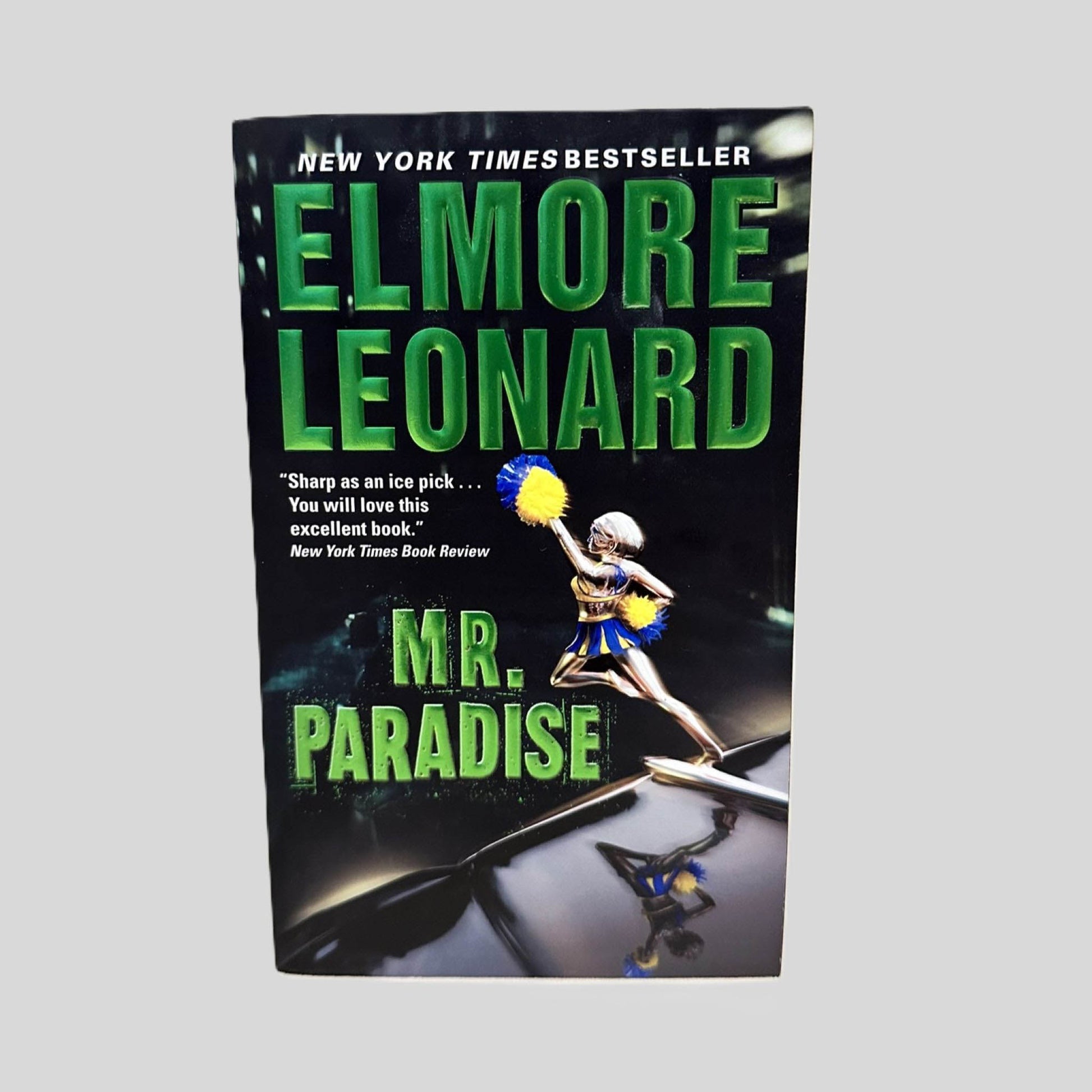 Front cover view of Mr. Paradise by Elmore Leonard centered on a neutral light gray background. 