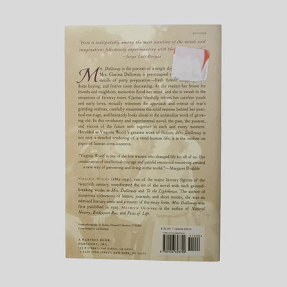 Back cover view of Mrs. Dalloway by Virginia Woolf centered on a neutral light gray background. No visible damage. Old pricing sticker attached in the top left corner.