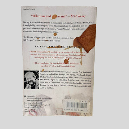 Back cover view of Notes from a Small Island by Bill Bryson centered on a neutral light gray background. Minor creasing in near the top spine corner.