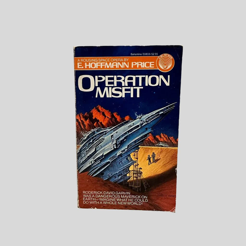 Front cover view of Operation Misfit by E. Hoffmann Price centered on a neutral light gray background. Creasing near the spine edge. Chipping around the edges from normal wear and age. Cover art is vibrant.