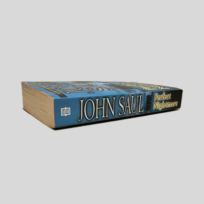 Close-up spine view of Perfect Nightmare by John Saul centered on a neutral light gray background. Spine is square and shows minimal creasing.