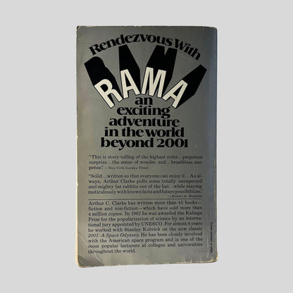 Back cover view of Rendezvous With Rama by Arthur C. Clarke centered on a neutral light gray background. Normal creasing and chipping from wear around the edges.